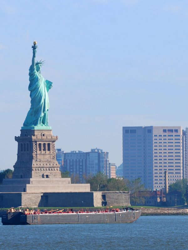 New York City Statue of Liberty with skyscrapers in Manhattan